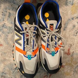New Balance Sneakers in Black, Orange, and Blue